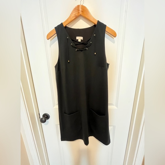 C Dresses & Skirts - C Black Lace-Up Lined Mini Dress. Two front pockets.
